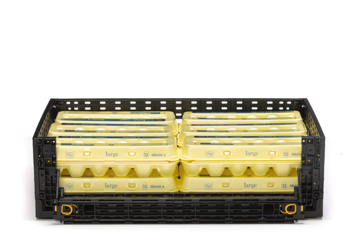 Retail-ready reusable plastic egg crate with a drop door feature, designed for easy restocking and enhanced product accessibility in-store.