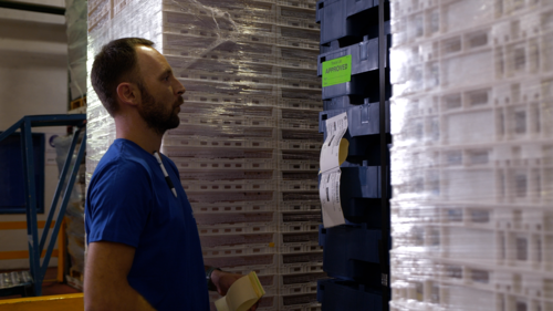 A Tosca worker inspects pallets to approve product quality at a service center. Customised transit packaging and quality assurance go hand in hand in meeting specific client needs.