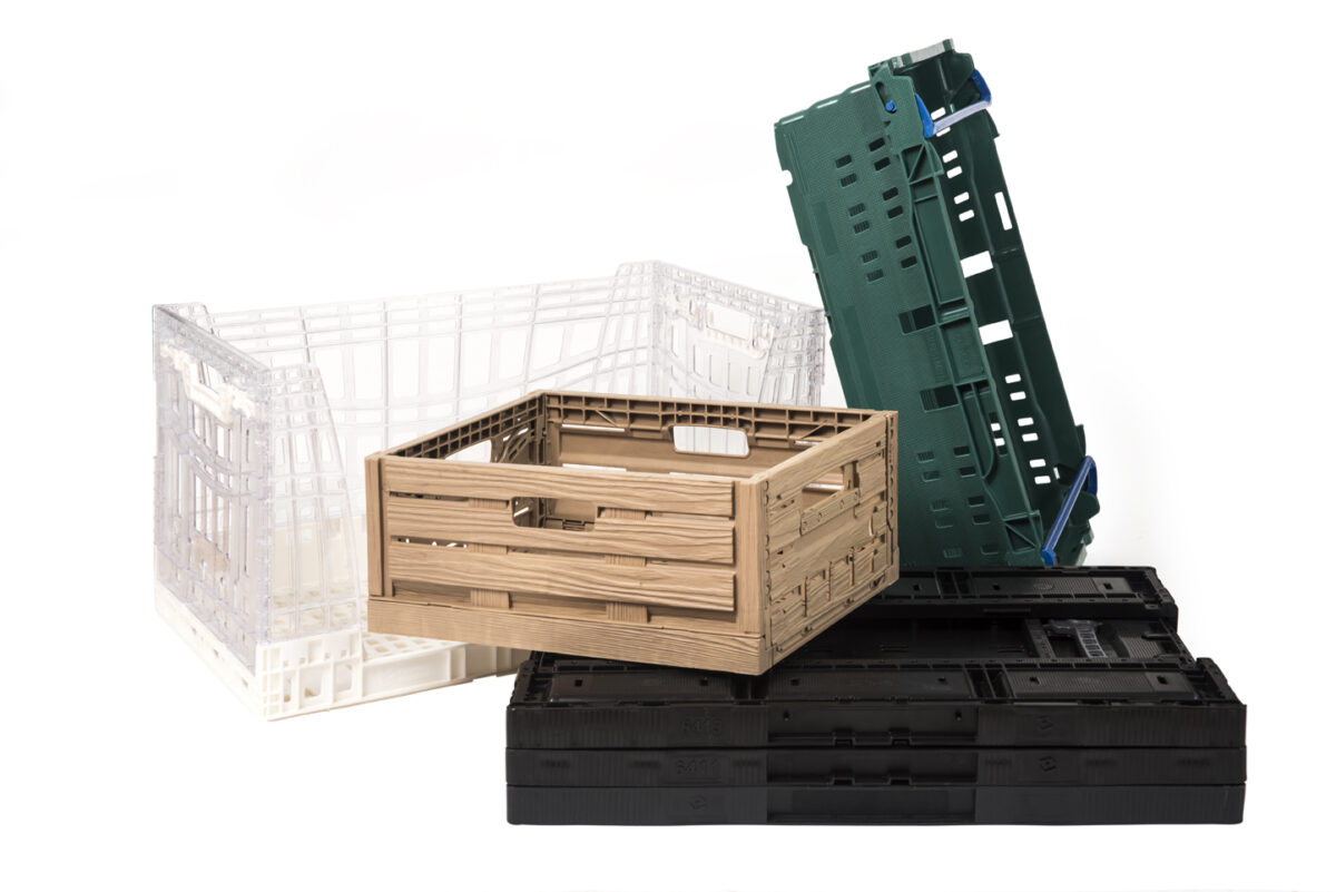 Reusable crates in wood-look green, and black, designed for efficient and sustainable packaging solutions across supply chains.