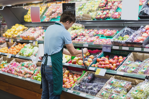Reusable transport packaging saves time unloading and stocking products, such as this employee pictured here