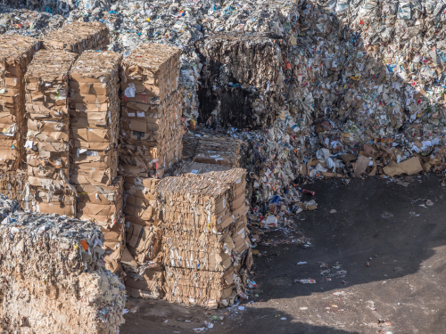 Corrugated cardboard waste in landfills (shown here) threaten our planet and supply chain sustainability