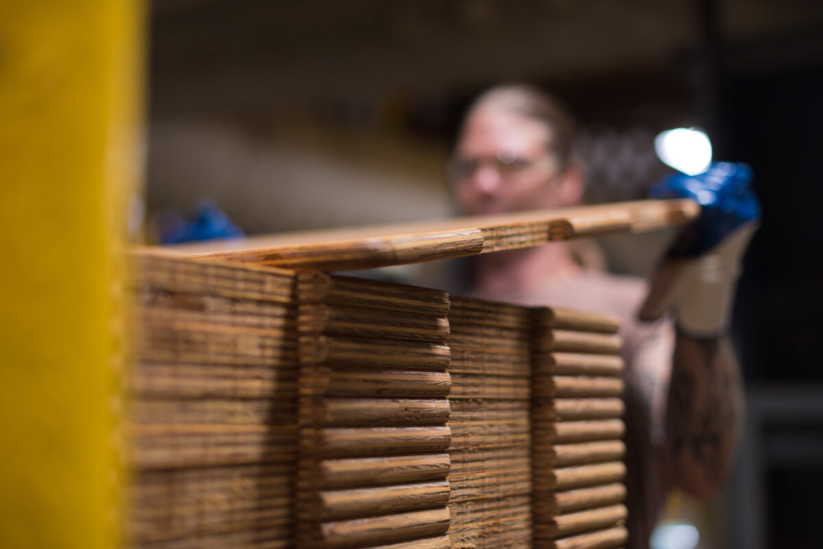 A close-up view of wood panels used to make Tosca bulk cheese containers.