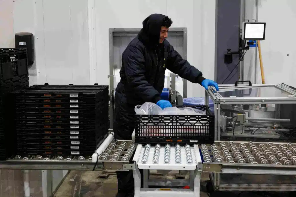 A worker moving the meat RPC in the warehouse of Brookshire Brothers
